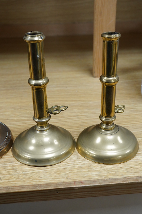 Two pairs of candlesticks to include 18th century brass ejector examples, 37cm wide. Condition - good